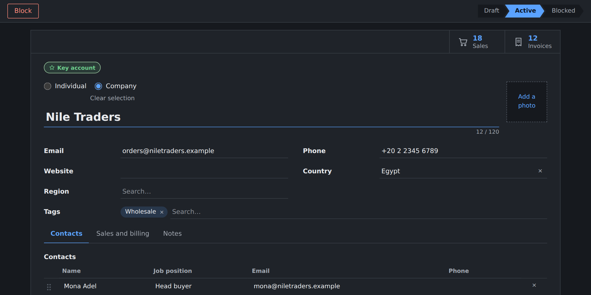 A customer record in the dark scheme: status bar, stat buttons, a Key account badge and fields in light words on a dark ground