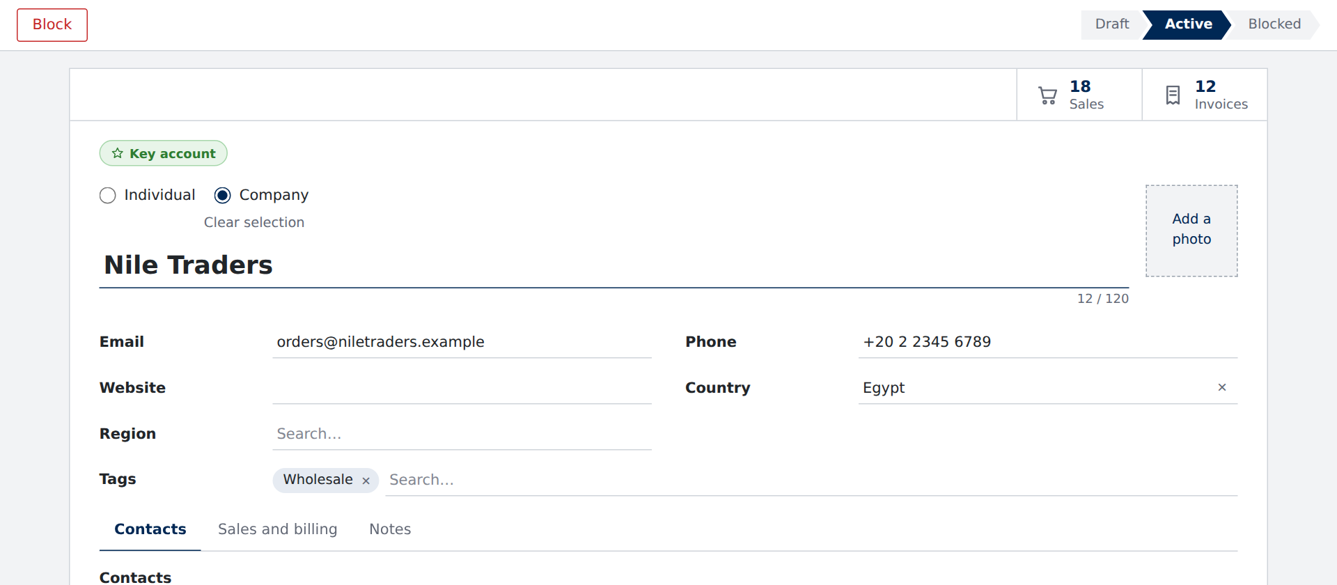 A customer record: Block beside a status bar at Active, stat buttons for 18 sales and 12 invoices, a Key account badge, and the name over its fields